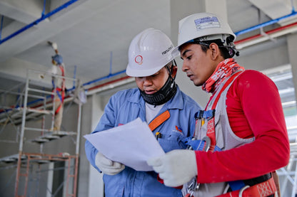 Maintenance engineer with clipboard inspecting industrial facility — BSD-MAINT-002-MID