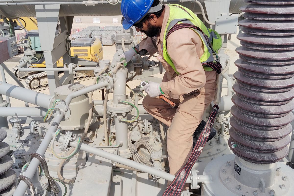 Engineer in safety helmet inspecting electrical equipment — BSD-MAINT-001 Preventive Maintenance Schedule